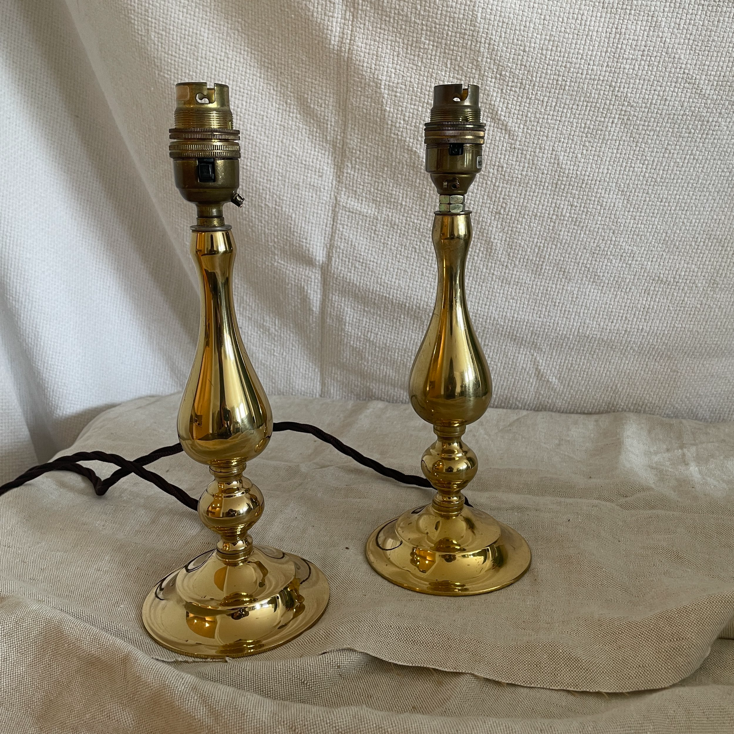 Pair of antiqued brass droplet lights